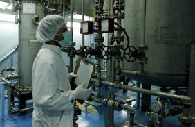 Technicians of the International Atomic Energy Agency inspect the site ot the uranium coversion plat of Isfahan